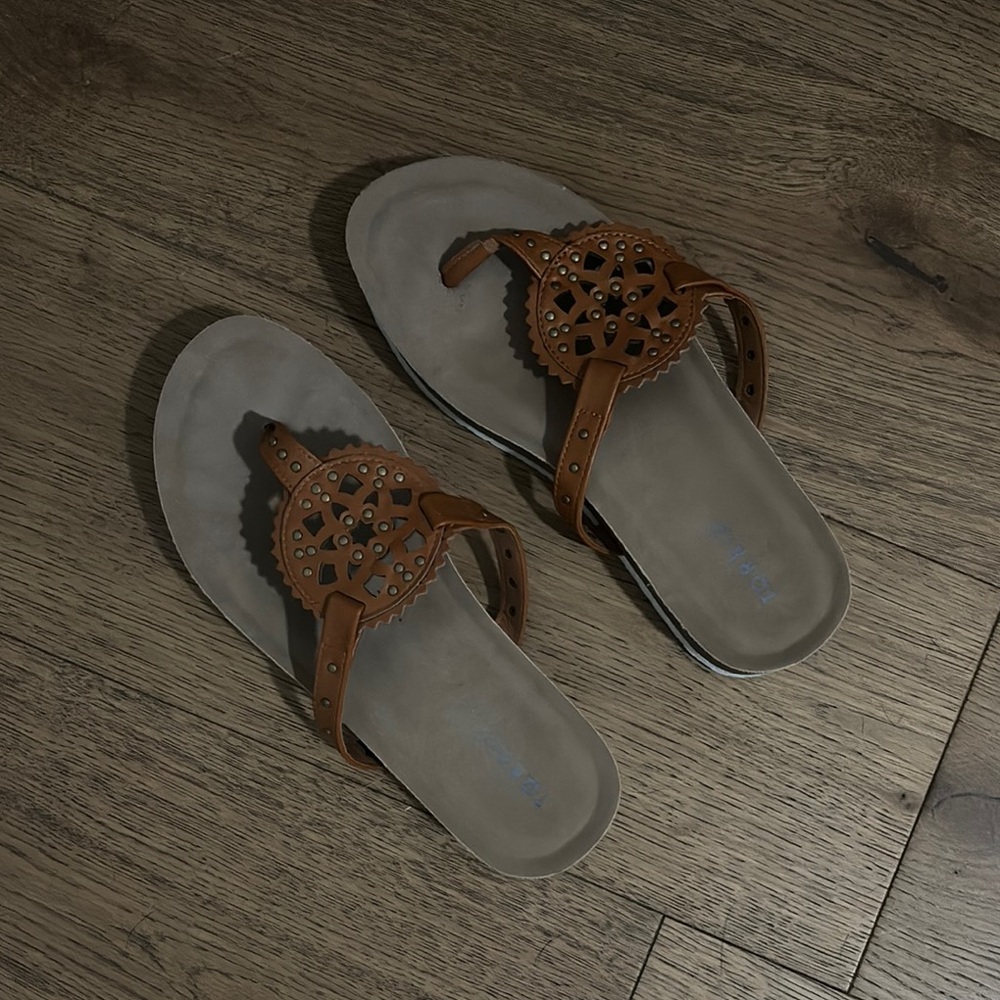Torrid Brown Sandals with Intricate Cut-Out Design